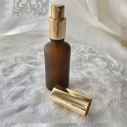 Buy an Amber Glass Homeopathic Mister in Frosted Amber with a Gold Pump, 50ml at The Surf Haberdashery